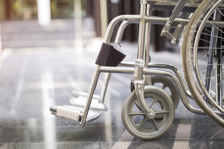 An aluminum wheel chair used by patients who are injured.